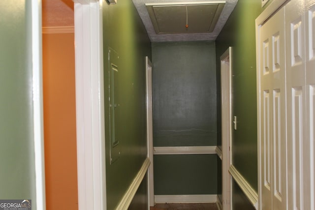 interior space with attic access and baseboards