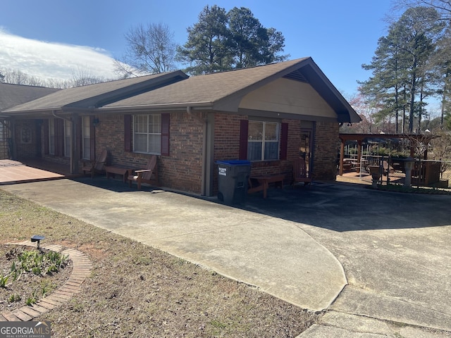 view of property exterior featuring brick siding