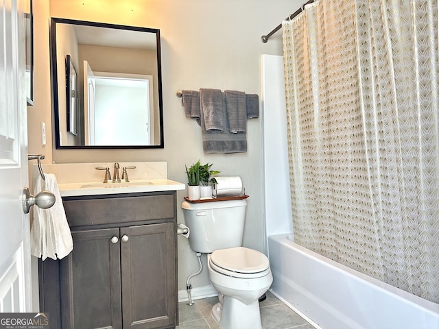 bathroom featuring vanity, shower / bath combo with shower curtain, tile patterned flooring, and toilet