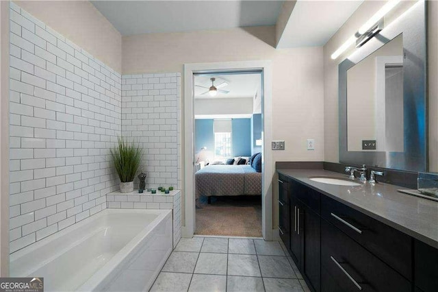 full bath with a ceiling fan, vanity, ensuite bath, tile patterned flooring, and a bath