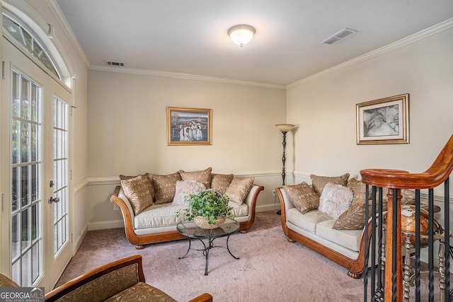 living area featuring ornamental molding, baseboards, visible vents, and carpet flooring