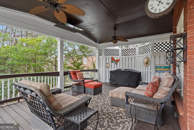 deck with an outdoor hangout area, ceiling fan, and a grill