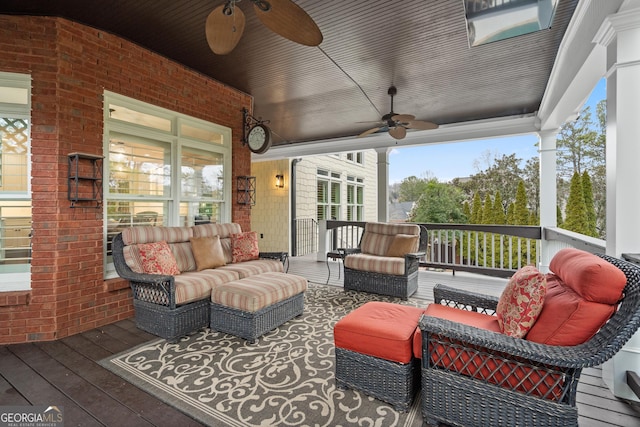 wooden deck featuring ceiling fan and an outdoor hangout area