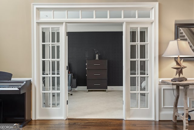 doorway with french doors and wood finished floors