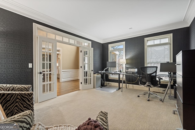 carpeted office space with ornamental molding, french doors, and a wainscoted wall