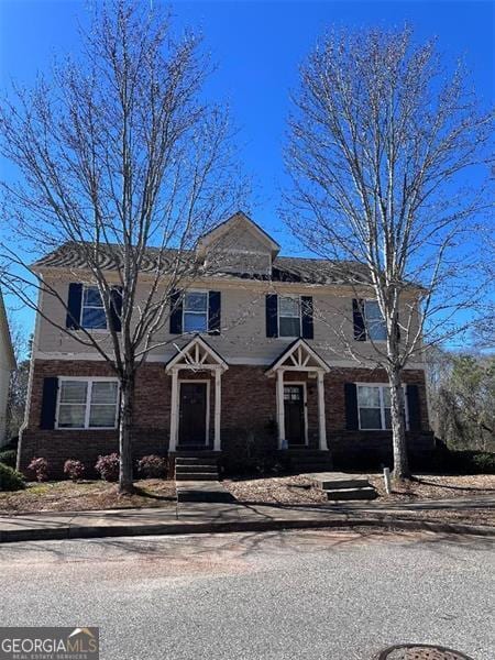 view of front of home with brick siding