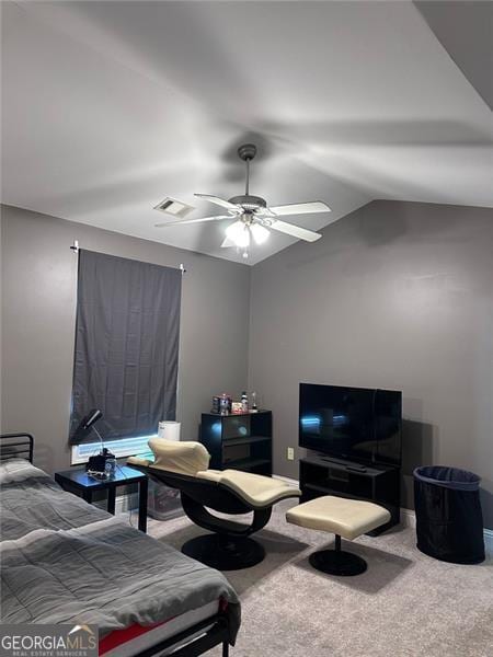 carpeted bedroom with lofted ceiling, visible vents, and a ceiling fan