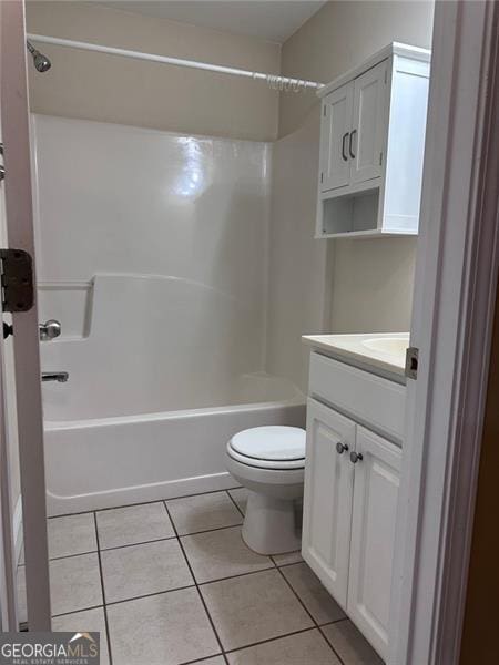 full bath featuring toilet, tub / shower combination, tile patterned flooring, and vanity