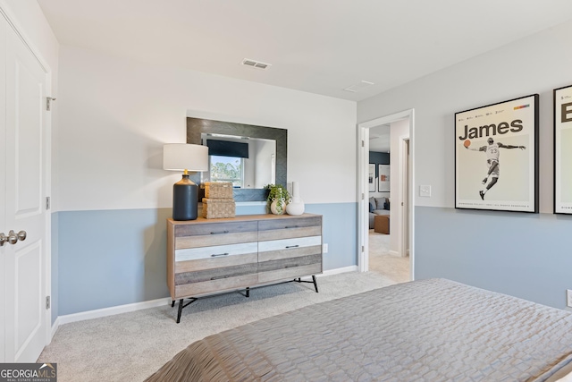 bedroom featuring light carpet, baseboards, and visible vents