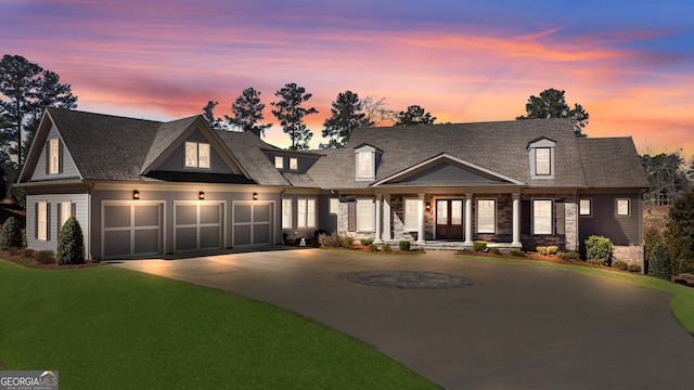 view of front of property featuring concrete driveway and a front yard