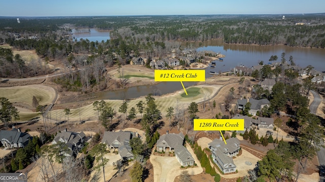 aerial view featuring a water view and a residential view