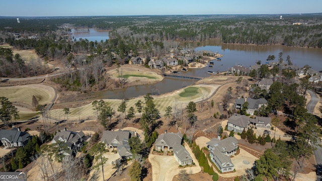 bird's eye view with a water view and a residential view