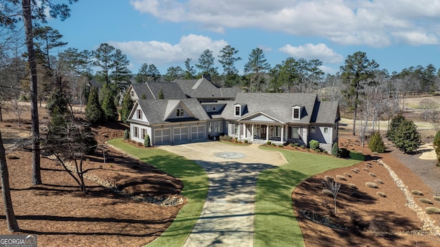 view of front of home with a garage and concrete driveway