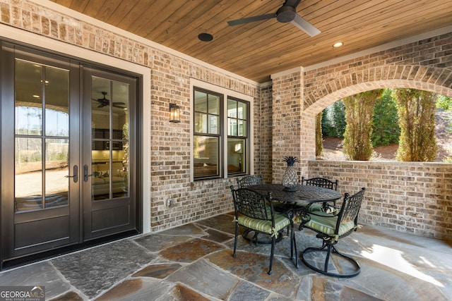 view of patio / terrace featuring a ceiling fan and french doors