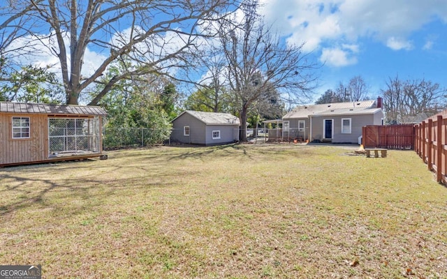 view of yard featuring a fenced backyard and an outdoor structure