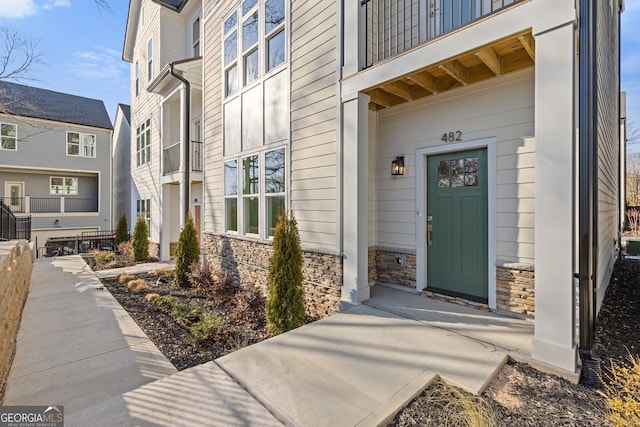 entrance to property with stone siding