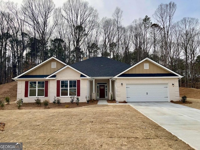 ranch-style house featuring a garage, concrete driveway, brick siding, and roof with shingles