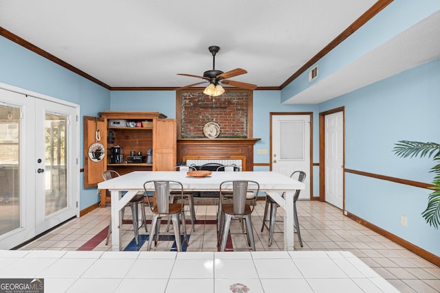 dining space featuring light tile patterned floors, visible vents, baseboards, french doors, and ornamental molding