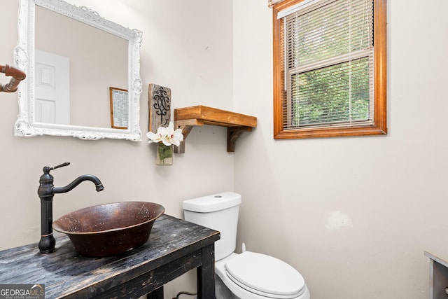 bathroom featuring a sink and toilet