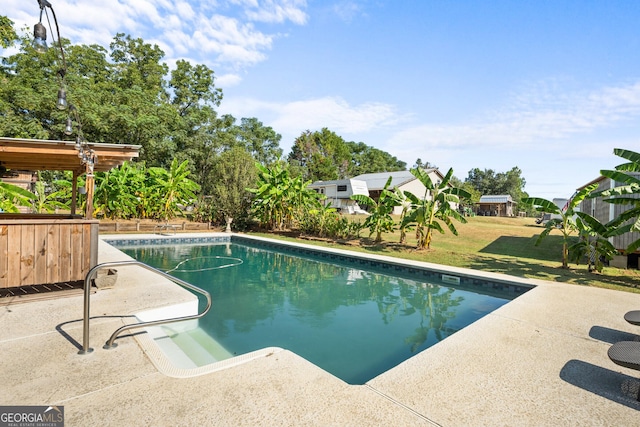 outdoor pool featuring a yard, a patio, and a pergola