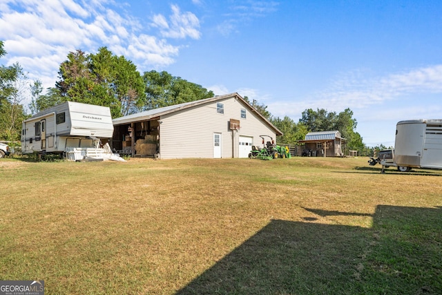 view of home's exterior featuring a garage and a yard