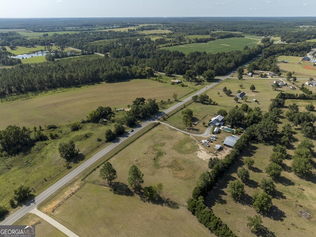 birds eye view of property with a rural view and a water view