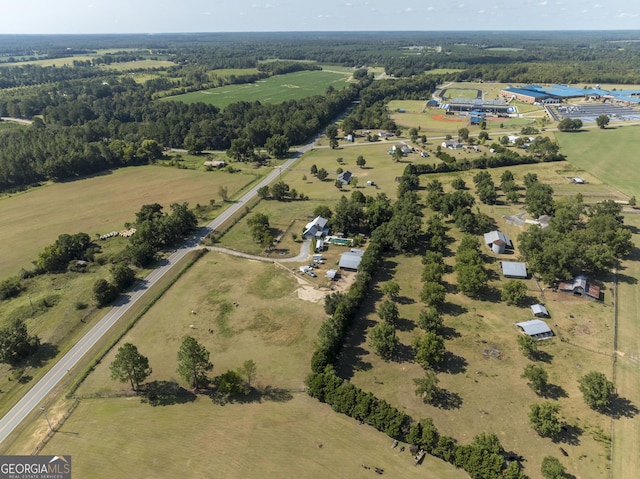 birds eye view of property with a rural view