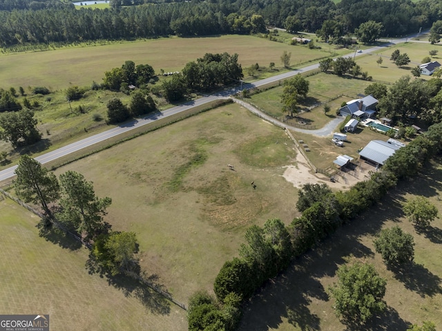 birds eye view of property with a rural view