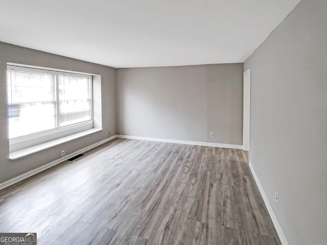 doorway to outside featuring crown molding, baseboards, dark wood-type flooring, and french doors