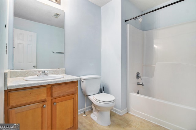 full bath with toilet, vanity, visible vents, baseboards, and tub / shower combination