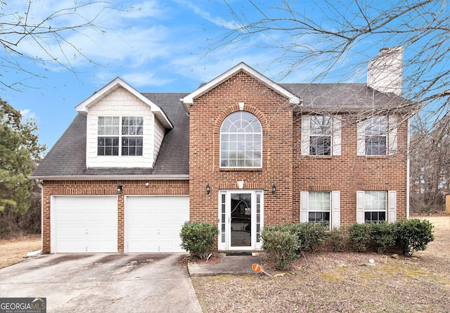 view of front of home featuring a garage, concrete driveway, brick siding, and a shingled roof