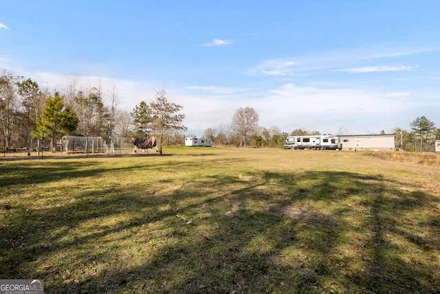 view of yard with a rural view