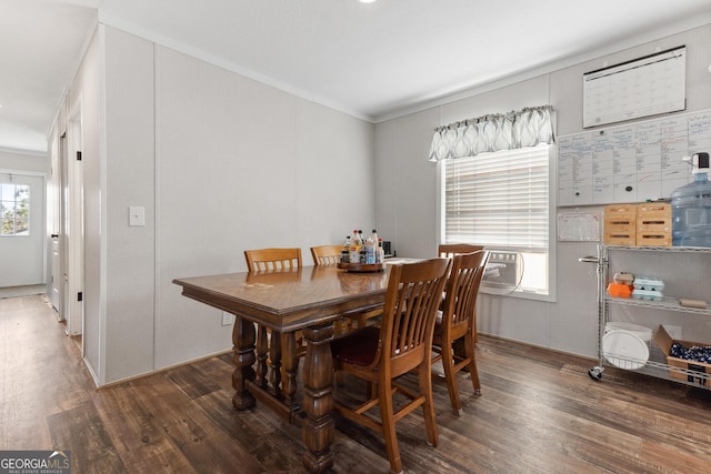 dining room with cooling unit and dark wood-style flooring