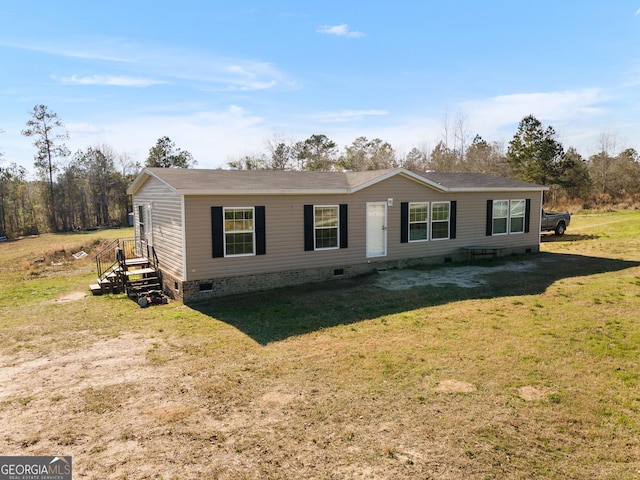 manufactured / mobile home with a front yard and crawl space