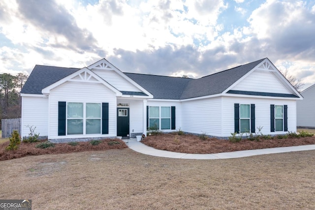 view of front of property with roof with shingles