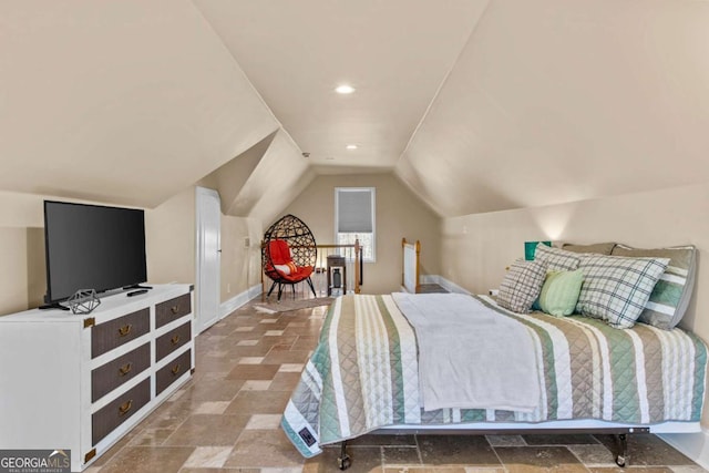 bedroom featuring vaulted ceiling, recessed lighting, stone tile flooring, and baseboards