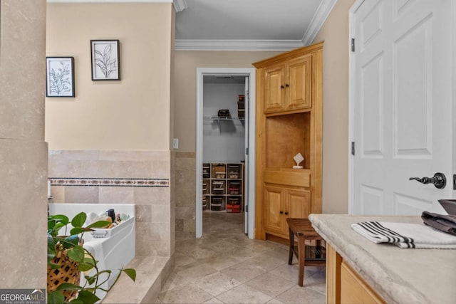 bathroom with ornamental molding and tile walls