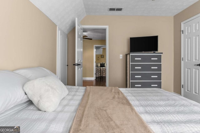 bedroom featuring visible vents and a textured ceiling