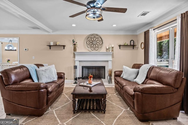 living room featuring ornamental molding, a fireplace, visible vents, and recessed lighting