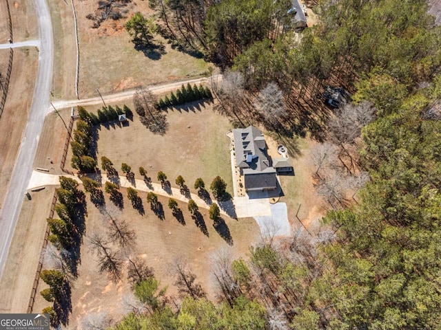 birds eye view of property with a rural view