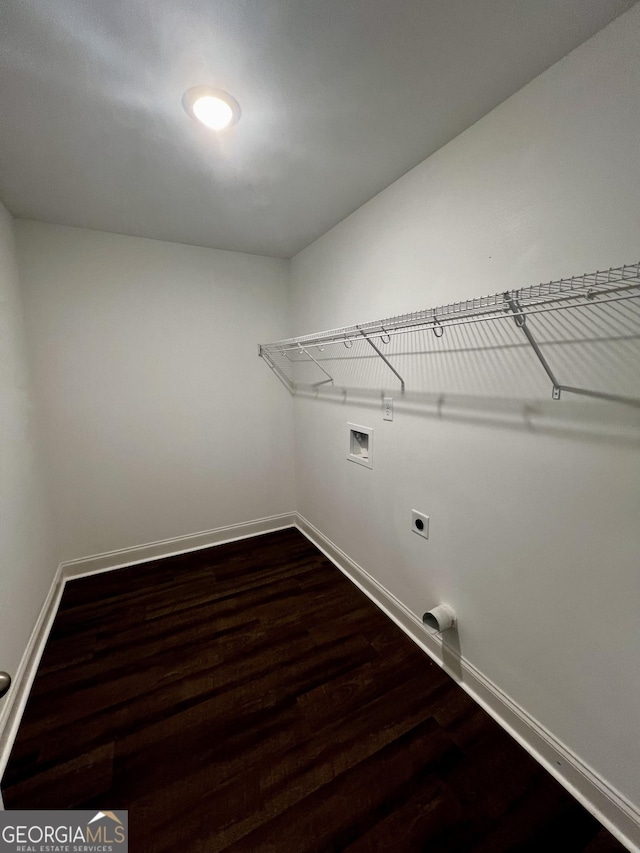 laundry room featuring laundry area, baseboards, dark wood-style floors, washer hookup, and electric dryer hookup