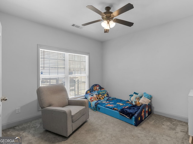 bedroom with baseboards, visible vents, ceiling fan, and carpet flooring