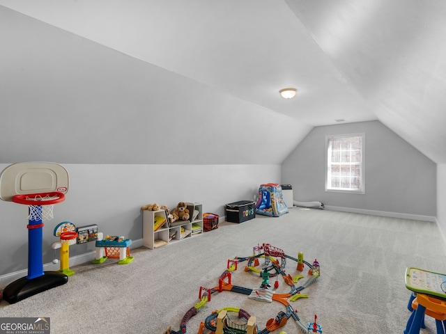 game room featuring lofted ceiling, carpet flooring, and baseboards