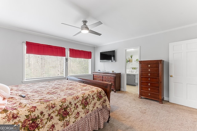 bedroom featuring baseboards, connected bathroom, a ceiling fan, light colored carpet, and crown molding