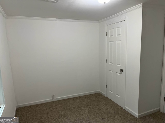 carpeted empty room with baseboards and ornamental molding