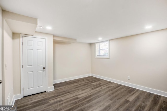 basement with dark wood-type flooring, recessed lighting, and baseboards