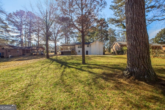 view of yard with a deck