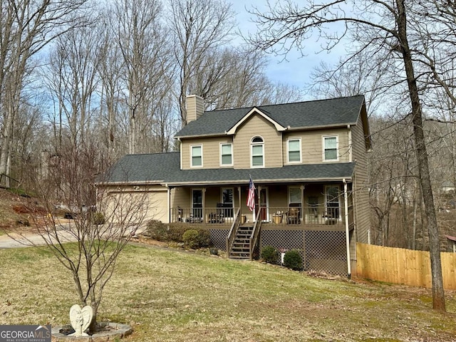 view of front of property with a porch, an attached garage, fence, a front lawn, and a chimney