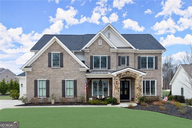 view of front of home with brick siding, central AC unit, a front yard, and roof with shingles