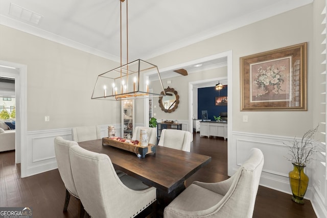 2903 Eva Clb, Acworth, GA 30101 - dining room featuring ornamental molding, a chandelier, a decorative wall, a wainscoted wall, and dark wood-style floors
